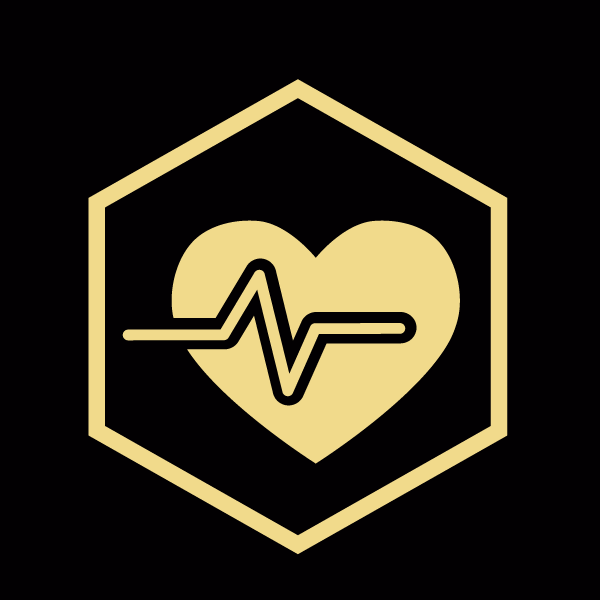 A gold heart with an ekg line in the middle of it.